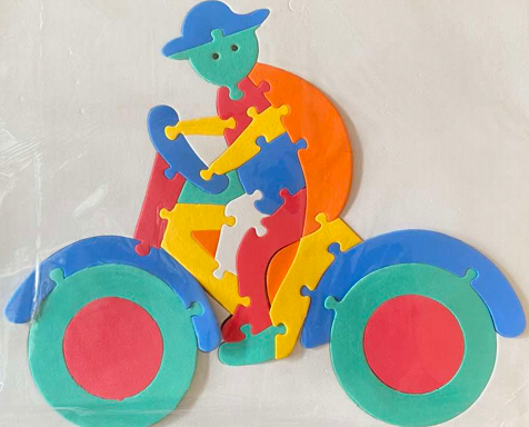 <p>65. BICYCLE SHAPED RUBBER JIGSAW PUZZLE</p>